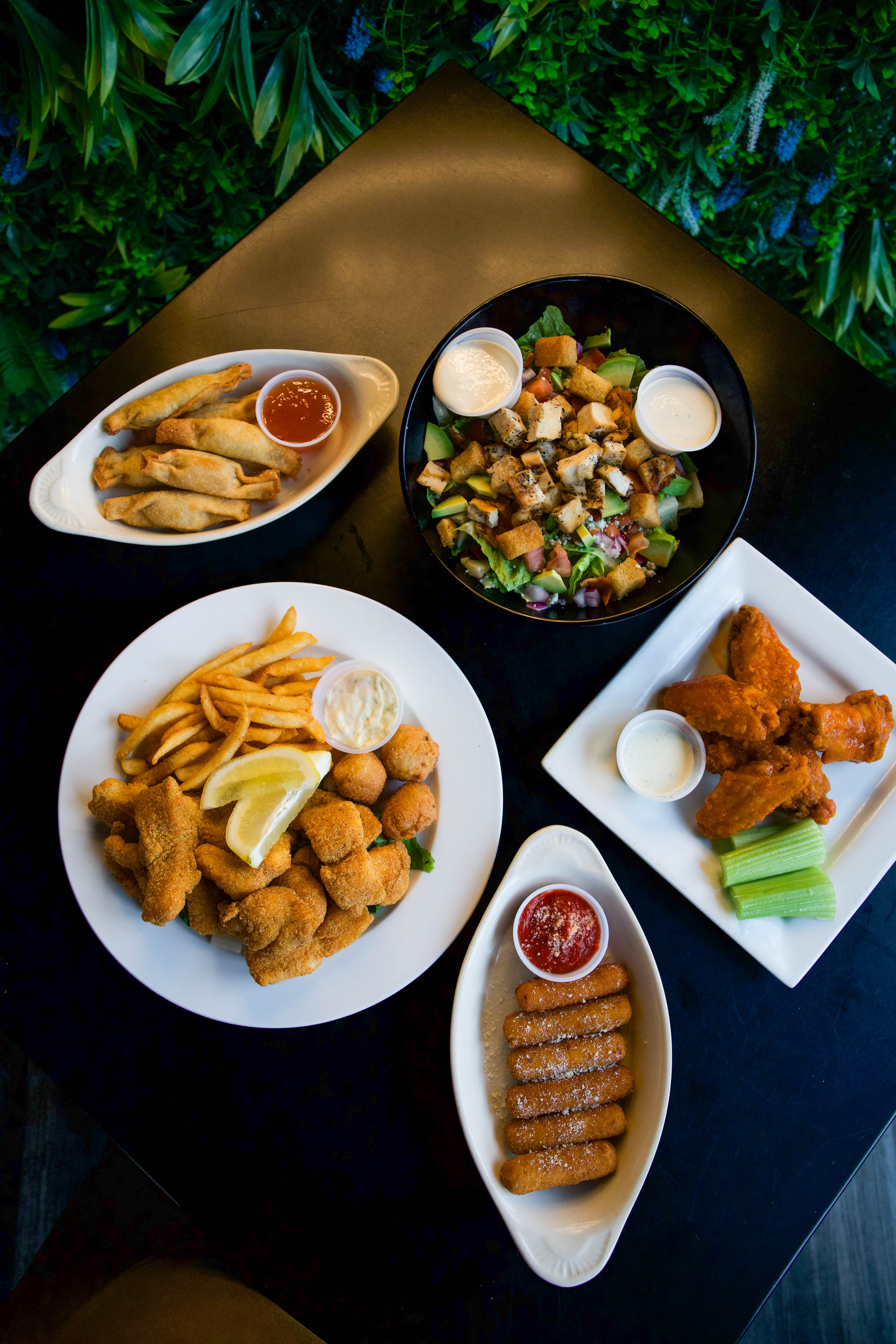 Bone-in buffalo wings with celery and ranch